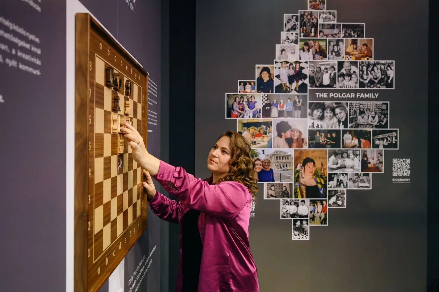 Chess Olympiad 2024 Budapest — Judit Polgar viewing the wall-mounted ChessboArt board