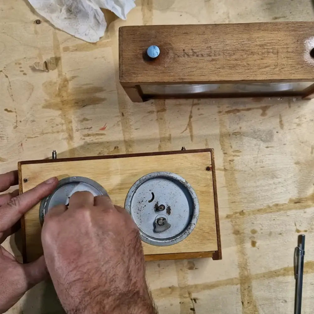 The process of refinishing an old wooden chess clock