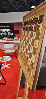 Signed wooden ChessboArt board with player autographs from Grand Chess Tour Warsaw 2026