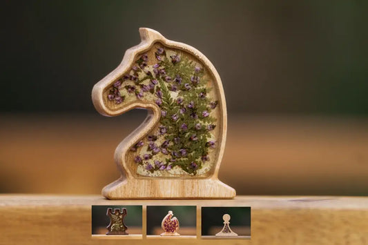 Close-up of ChessboArt solid wood magnetic chess pieces with epoxy and flowers (Knight, Rook, Bishop, Pawn) showing natural grain and press-fit construction without glue.