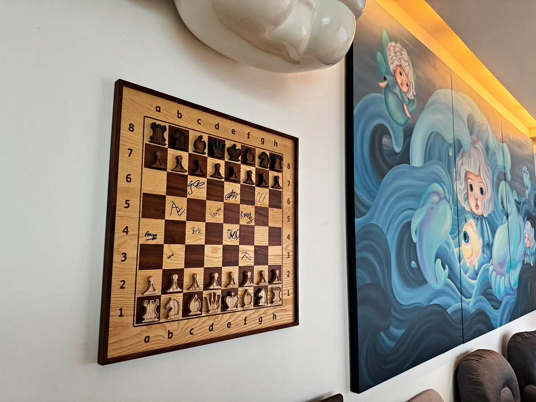 Signed walnut and ash ChessboArt800 wall chessboard hanging beside a large blue wave mural in a private home