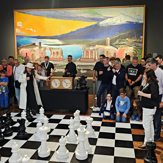 Judit and Sofia Polgár playing on the giant chess set using ChessboArt's custom giant chess clock at the Global Chess Festival 2026