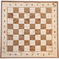 Handcrafted wooden chessboard with algebraic notation and the ChessboArt logo.