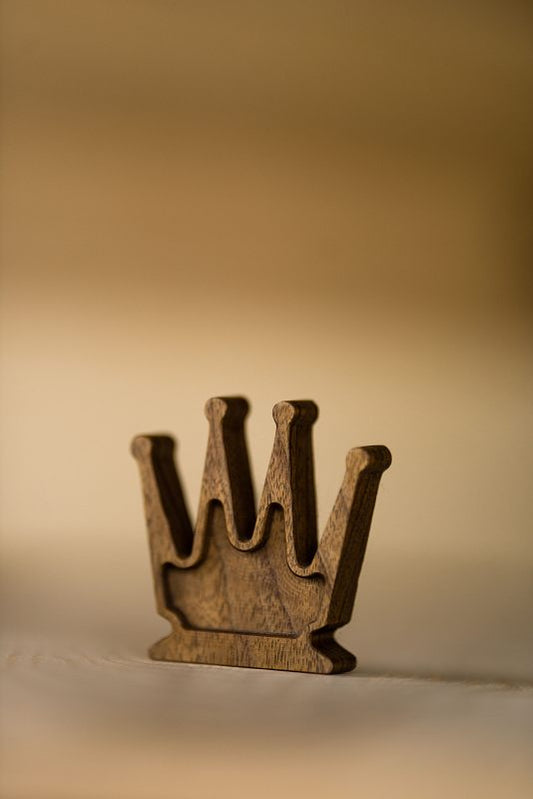 Fine art photograph of a wooden chess queen, minimalist composition, handcrafted design by Monika Burszczan