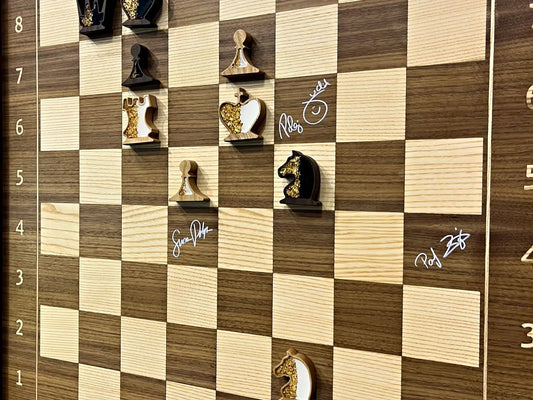 Judit Polgar signing the ChessboArt800 wall-mounted chess board — Chess Olympiad 2024, Budapest (EXPO)