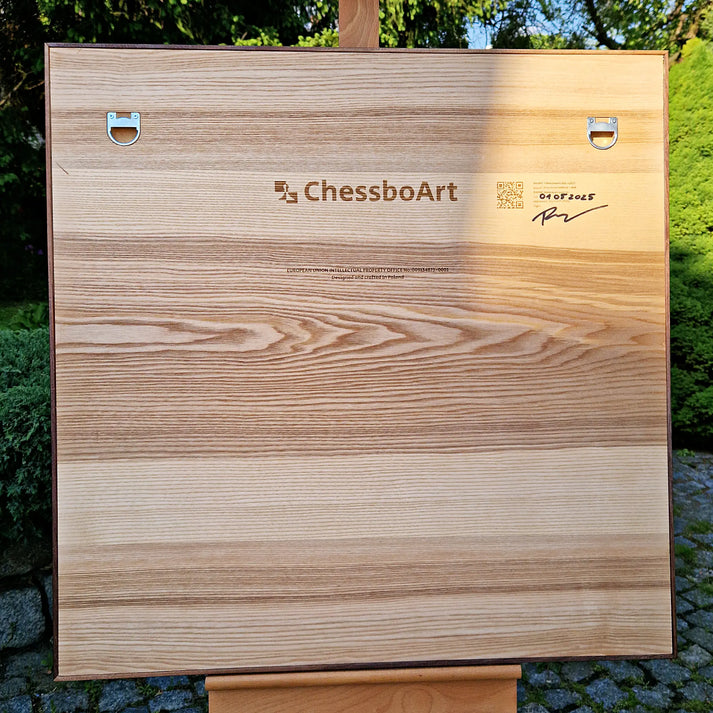 Back view of a wooden ChessboArt vertical chessboard showing recessed metal hanging points.