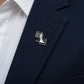 Pawn-shaped lapel pin worn on a tailored navy blue suit jacket