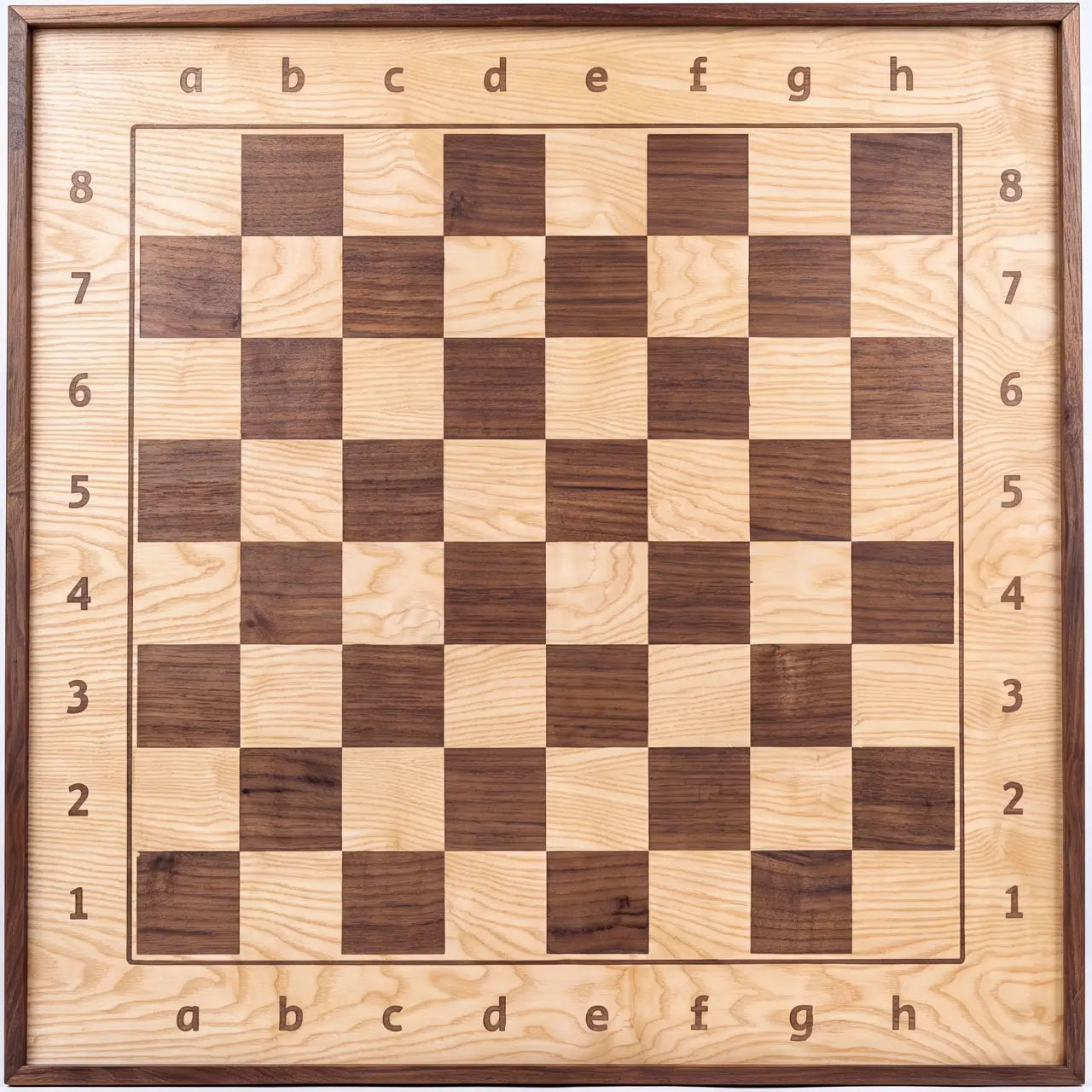 Front view of the ChessboArt 800 wooden wall chessboard, primarily made of light ash wood with dark walnut squares, showing the playing surface and alphanumeric notation.