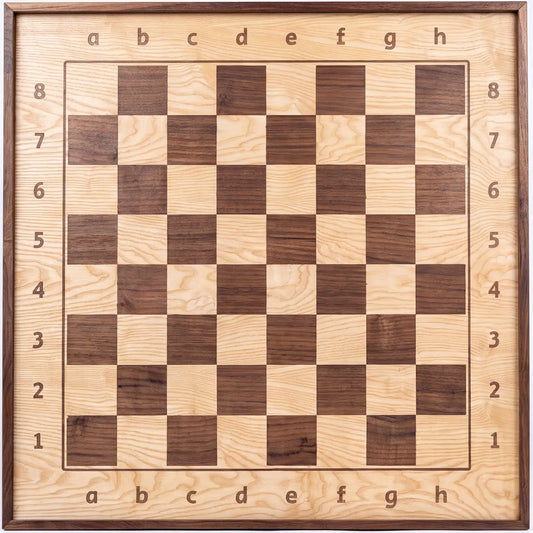 Front view of the ChessboArt 800 wooden wall chessboard, primarily made of light ash wood with dark walnut squares, showing the playing surface and alphanumeric notation.