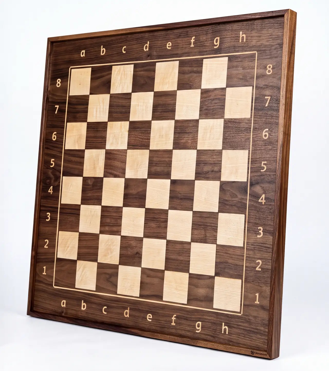 Angled view of the ChessboArt 800 wall-mounted chessboard made from American walnut and light ash, showcasing the solid wooden frame and edge details.