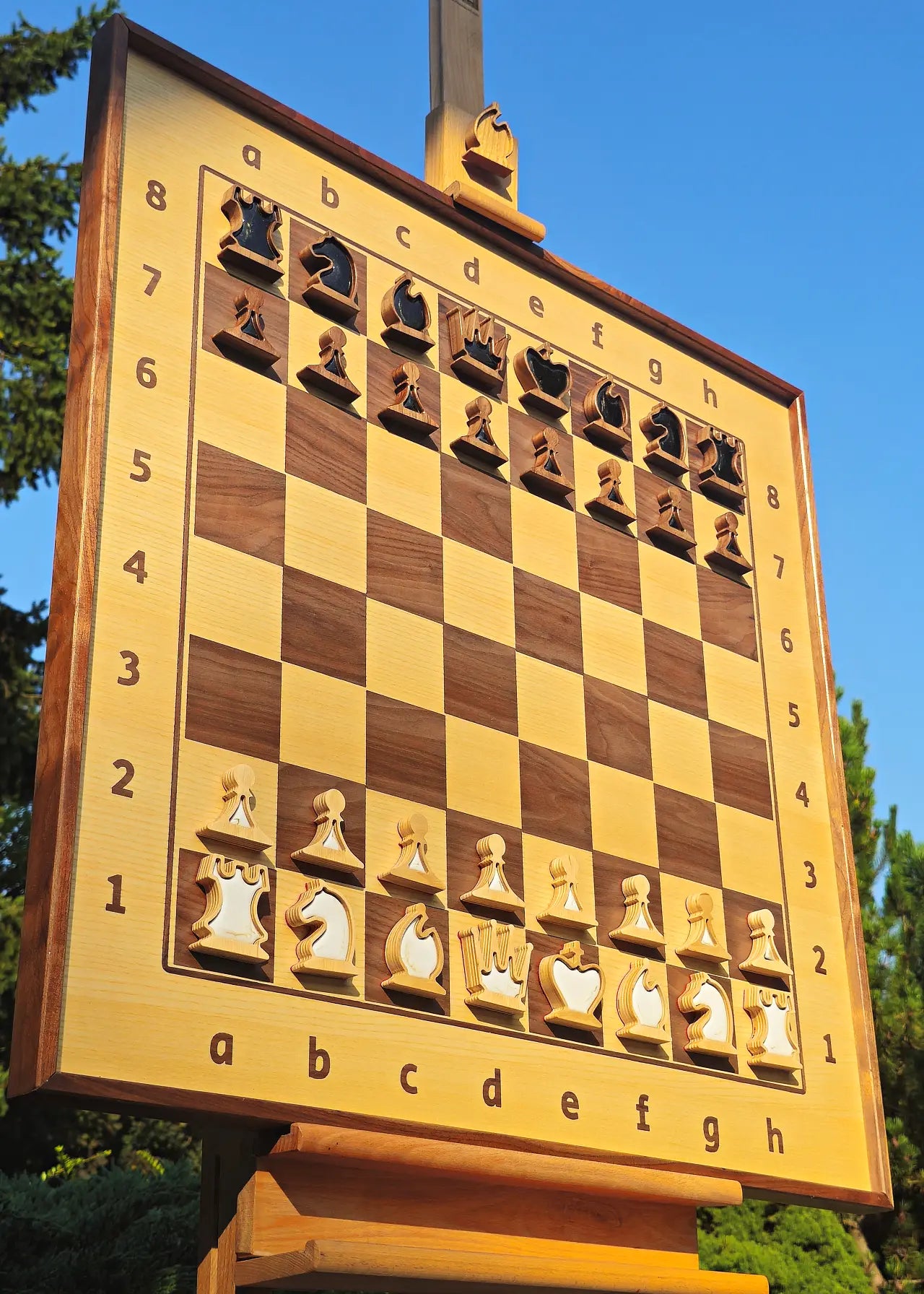 Wall chess board in starting position with pearl black and white magnetic epoxy resin inlays