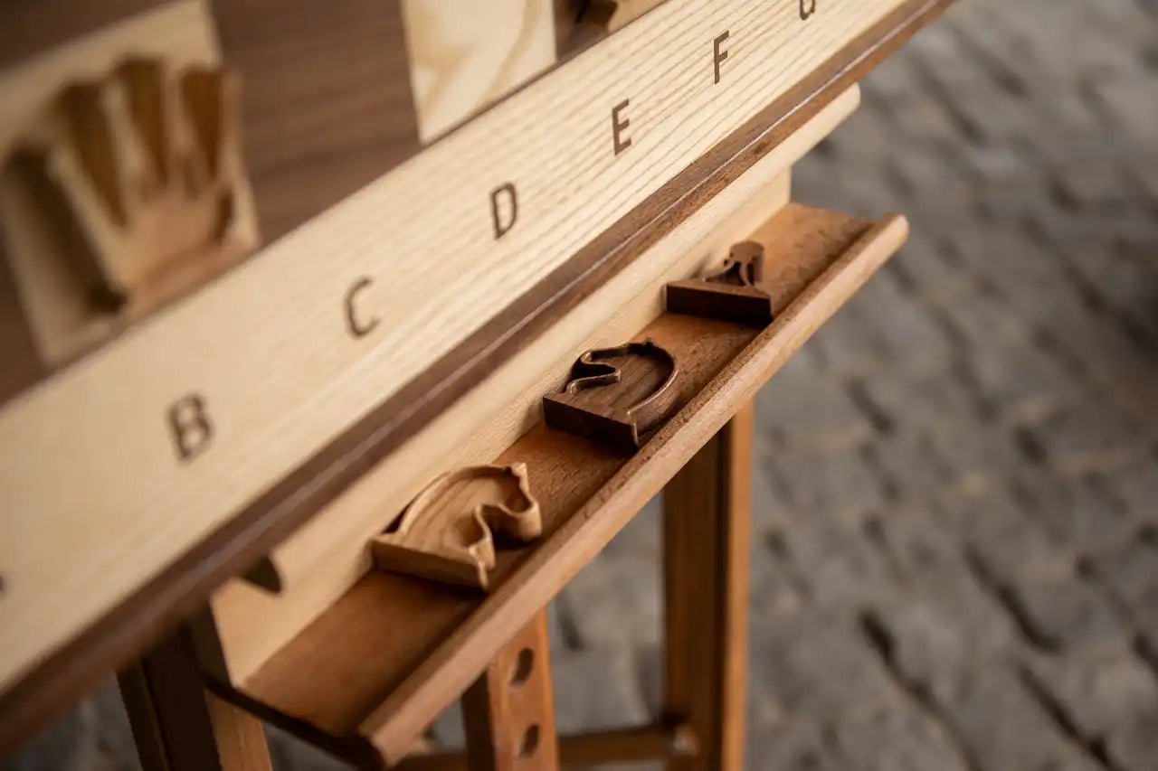 Detailed view of handcrafted magnetic wooden chess pieces on a vertical board by ChessboArt manufacture, displayed on an artistic easel stand