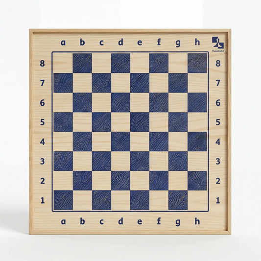 Frontal studio shot of ChessboINK, a vertical wall-mounted magnetic chessboard handcrafted from natural ash wood with deep blue squares, isolated on a pure white background.