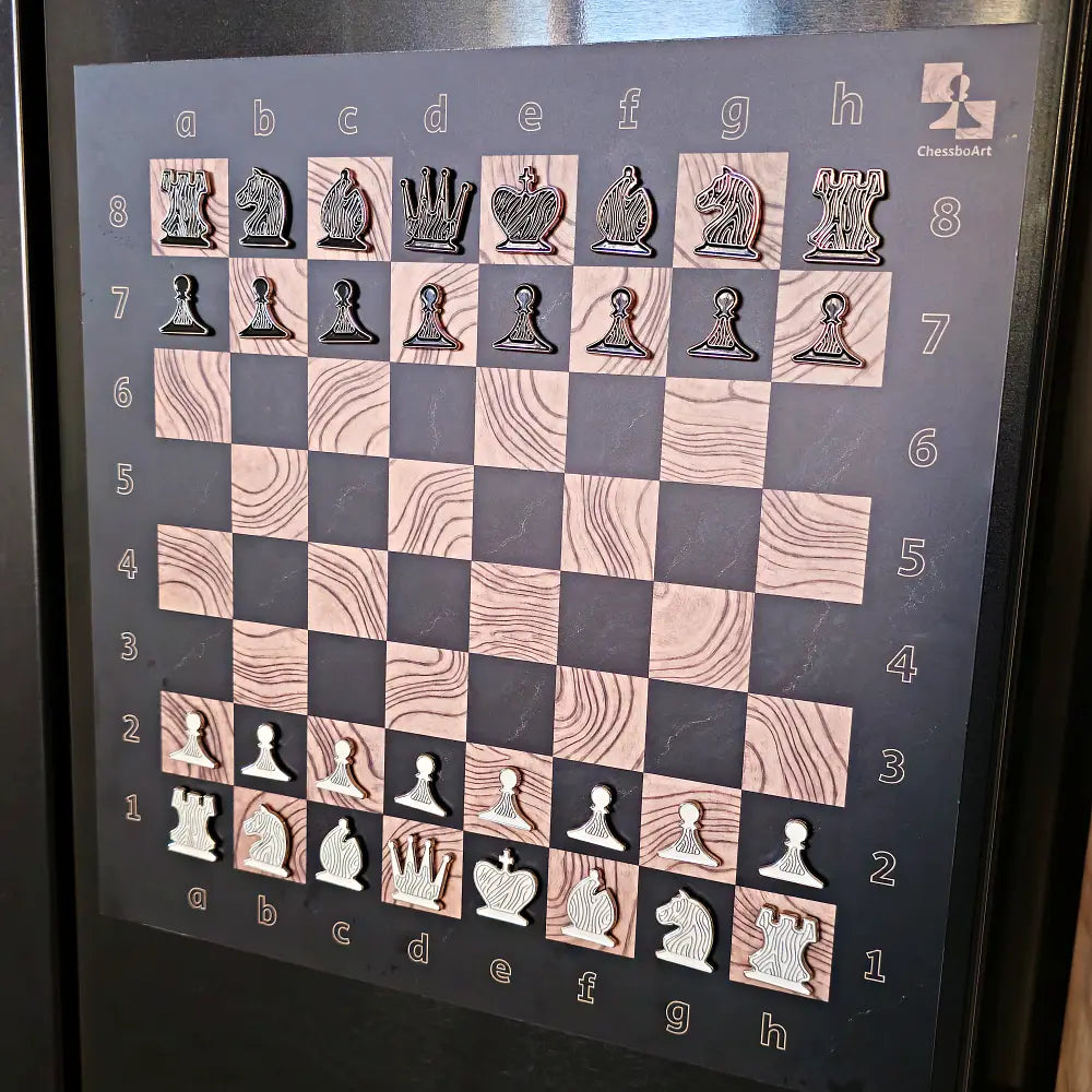 ChessboPIN magnetic chess set with Ebony Grain board mounted on a refrigerator, full starting position