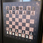 ChessboPIN magnetic chess set with Ebony Grain board mounted on a refrigerator, full starting position