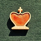 Chess king piece fitted with a copper-toned magnetic epoxy resin inlay