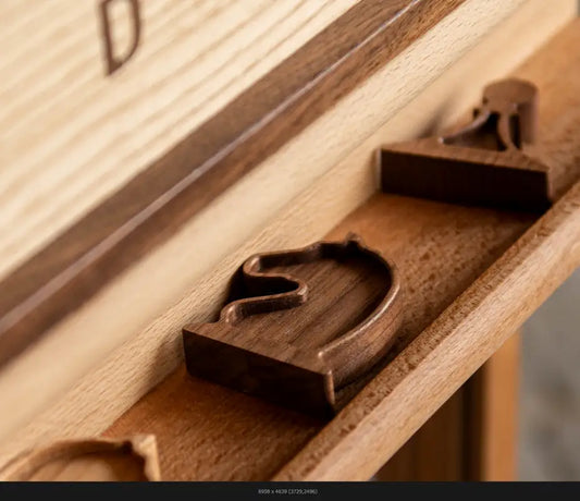 Close-up detail of wooden chess pieces on a ChessboArt board showing material texture and craftsmanship