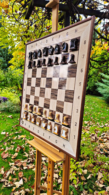 ChessClub magnetic wall chess board with sapele frame and pieces on an easel in an autumn garden