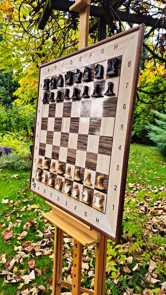 ChessClub magnetic wall chess board with sapele frame and pieces on an easel in an autumn garden