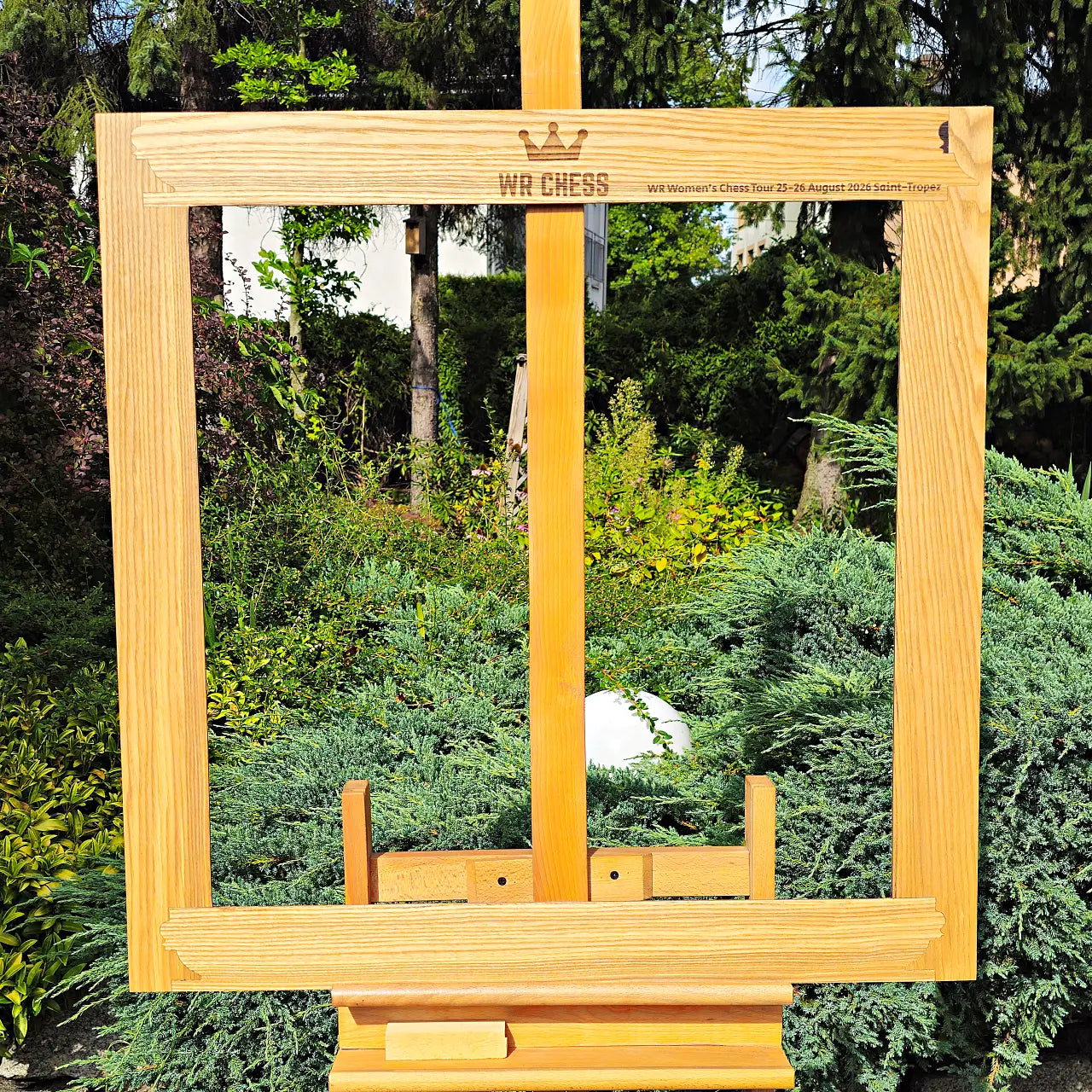 Personalized wall chess frame engraved with a custom event logo and tournament dedication text