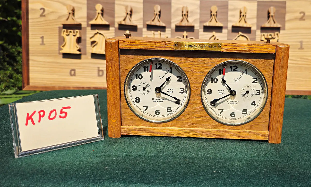 A rare vintage analog chess game clock, model KP05. Showcases beautiful woodcraft casing with original mechanical dials, perfect for classic blitz chess matches.