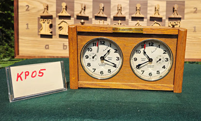 A rare vintage analog chess game clock, model KP05. Showcases beautiful woodcraft casing with original mechanical dials, perfect for classic blitz chess matches.