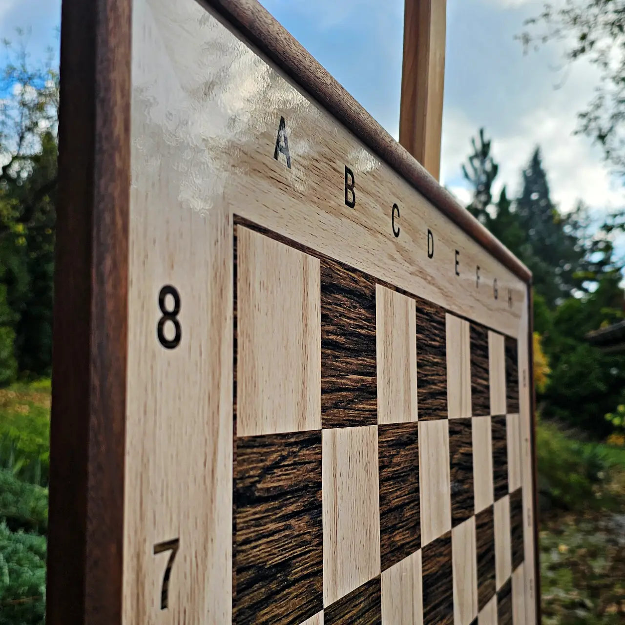 Stained sapele wood frame and coordinates in the top-left corner of a magnetic chess board