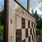 Stained sapele wood frame and coordinates in the top-left corner of a magnetic chess board