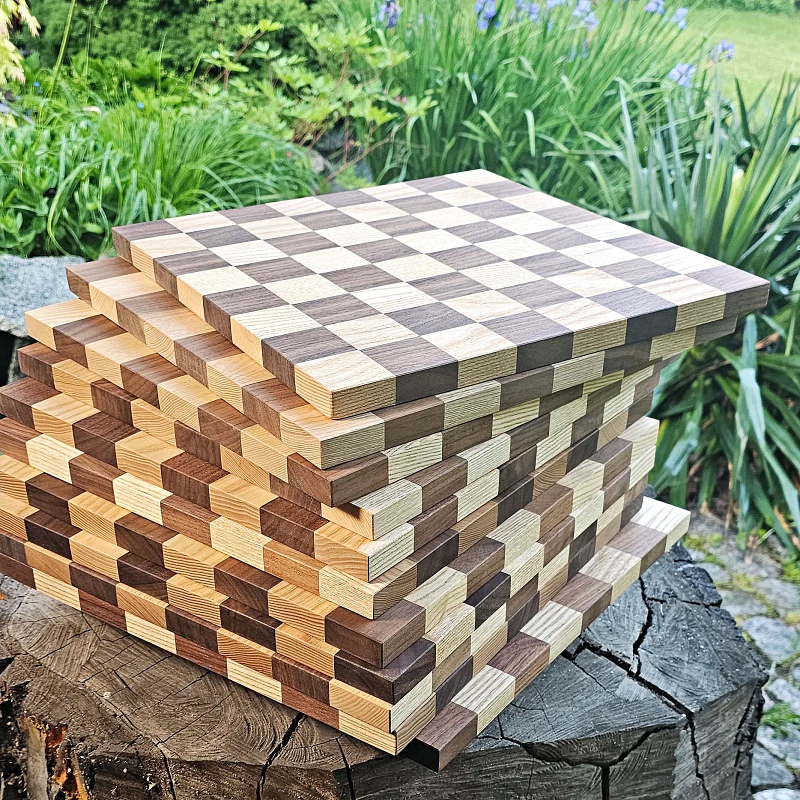 Stack of handmade solid wood chess boards in American walnut and European ash — 360 × 360 mm, natural oil finish, made in Poland by ChessboArt