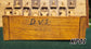 Bottom view of the vintage wooden Koopman chess clock, model KP01. The wooden base features handwritten 'D.V.S.' initials and an authentic, faded production stamp reading '12 SEP 1961', confirming its genuine 1960s origin.