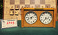Front view of a working vintage wooden chess clock from the 1960s, model KP03. The clock features two analog dials by H. Koopman Dordrecht and a brass C. Kommandeur-Klok plaque, displayed next to a ChessboArt identification card.