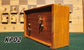 Isometric view showing the side and back panel of a vintage wooden chess clock, model KP02. The image highlights the natural wood grain on the side casing and the original metal mechanical winding keys and adjustment knobs on the darker back panel.