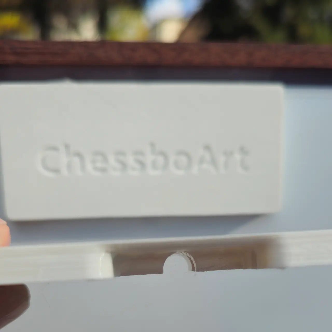 Wall hanger on the back of the ChessClub board for easy hanging