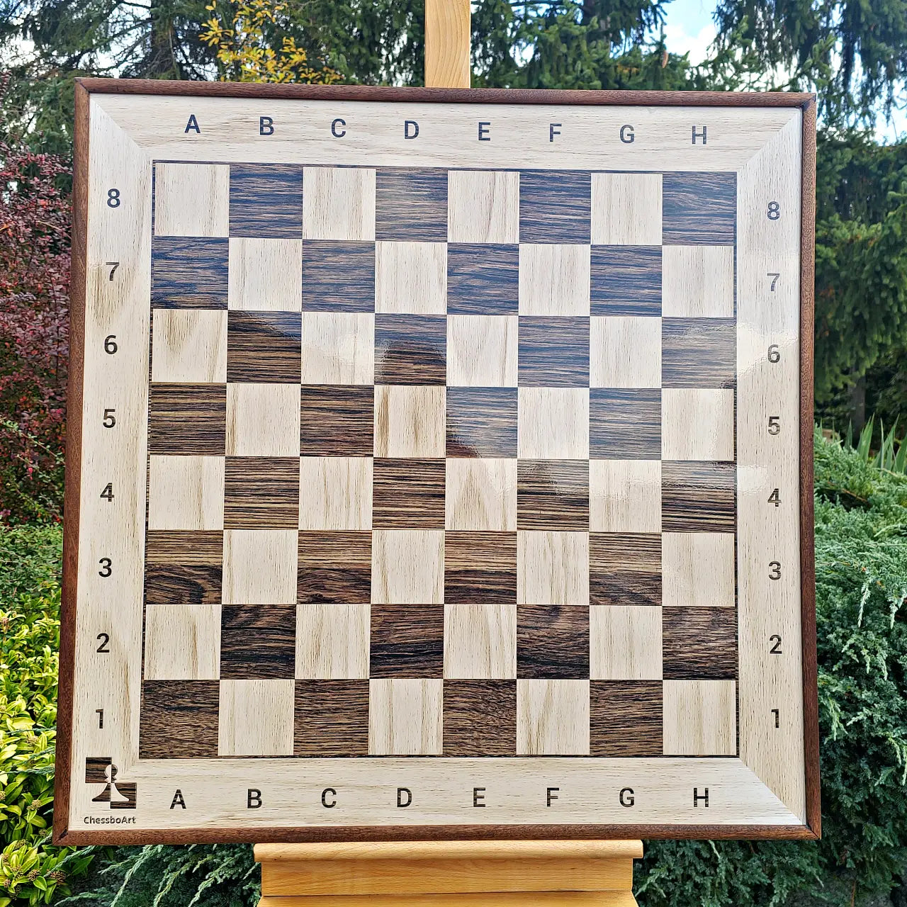 Front view of an empty 800 mm wall chess board in a stained sapele frame