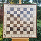 Front view of an empty 800 mm wall chess board in a stained sapele frame
