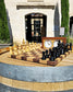 Chess set mid-game on a wine barrel outside the entrance to Le Vignoble Torpez, Saint-Tropez